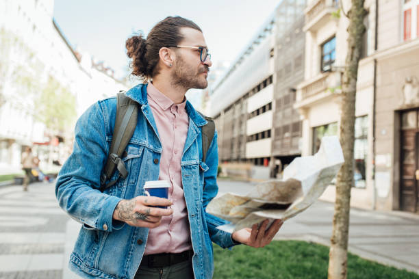 istock Young tourist enjoying coffee and exploring the city 1355905581