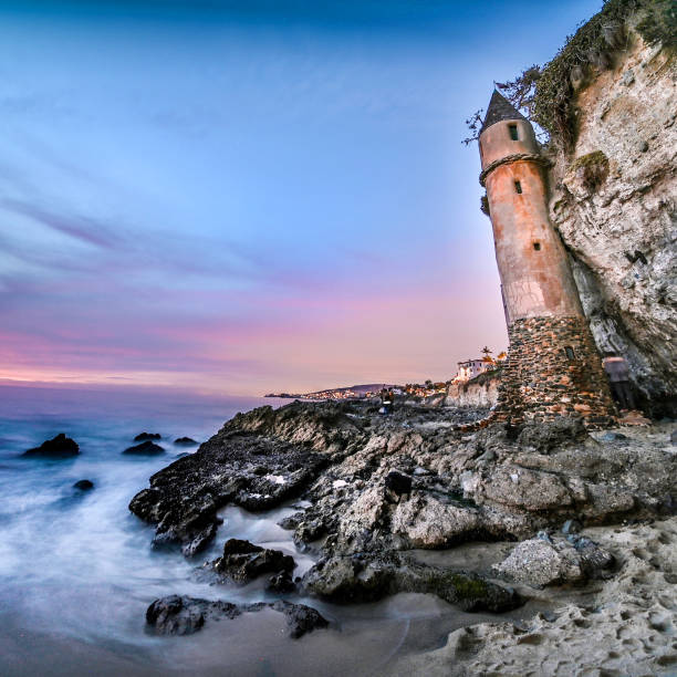 istock Laguna Pirate's Tower sandcastle at sunset. 1355911277