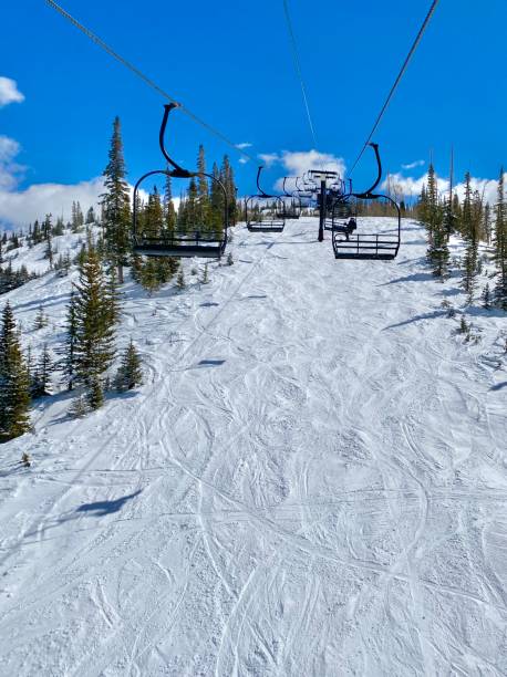 istock Chairlifts on a snowy mountainside. 1355911955