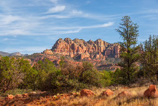 Seven Warriors is a long ridge with seven prominent peaks.  This view of Seven Warriors was photographed from the Turkey Creek Trail in the Coconino National Forest near the Village of Oak Creek, Arizona, USA.