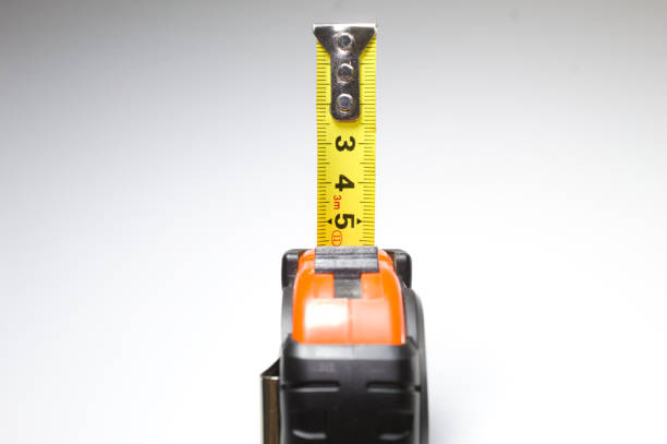 istock Tape measure with white background 1355913203