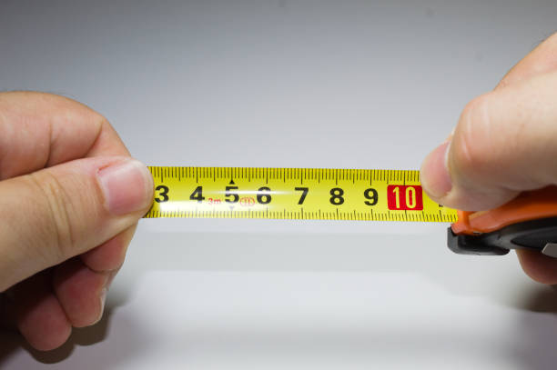 istock Tape measure with white background 1355913860