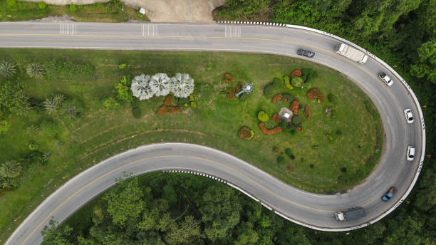 istock Winding road through the mountain pass,  Aerial view by drone. 1355914298