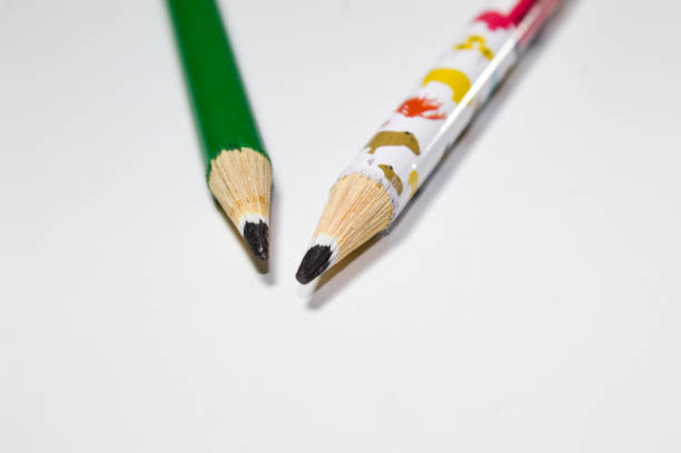 A collection of coloured pencils on white background.