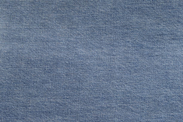 istock Denim background in blue fabric 1355915881