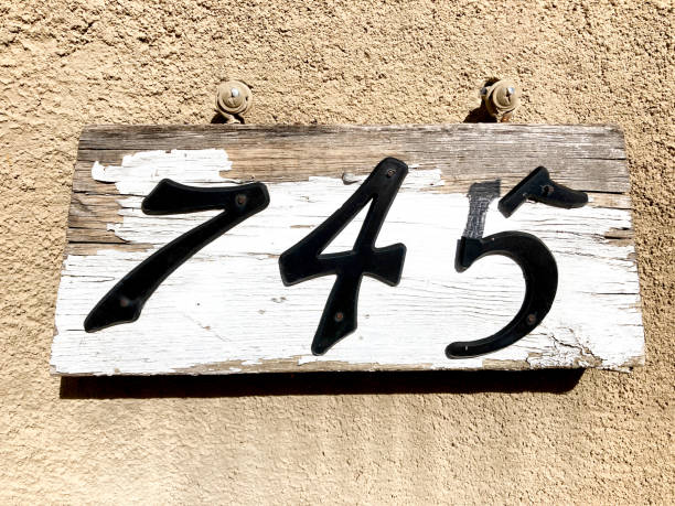 istock Weathered Wood House Address Close-Up: 745 1355917021