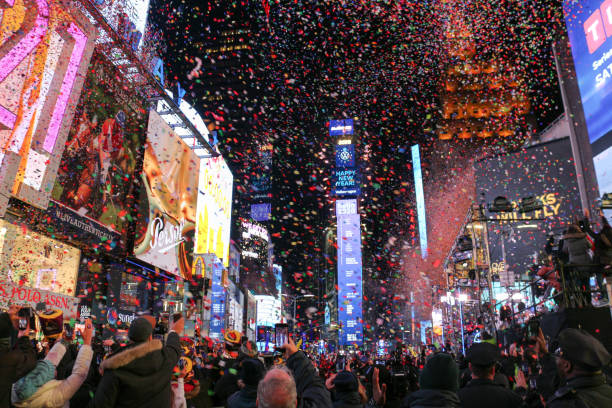 New Year Eve Confetti flying during the New Year Ball Drop event at Times Square in New York City during the new year eve on January 1, 2020. times square new years eve stock pictures, royalty-free photos & images