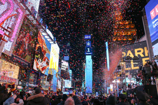 New Year Eve Confetti flying during the New Year Ball Drop event at Times Square in New York City during the new year eve on January 1, 2020. times square new years eve stock pictures, royalty-free photos & images