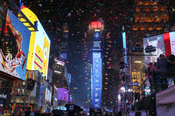 New Year Eve Confetti flying during the New Year Ball Drop event at Times Square in New York City during the new year eve on January 1, 2020. times square new years eve stock pictures, royalty-free photos & images