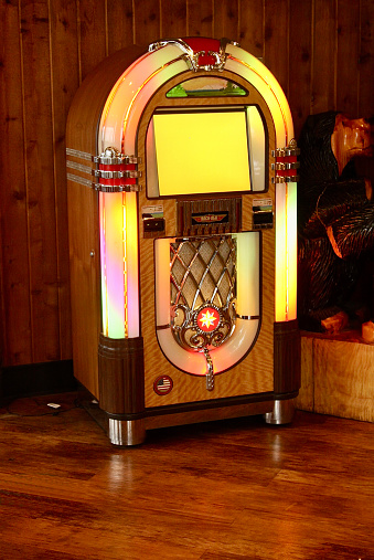 An old fashioned jukebox that plays songs
