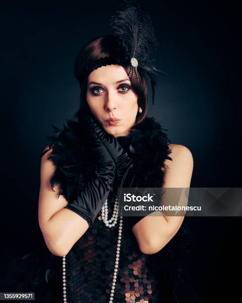 Funny Surprised Flapper Girl Wearing Feathers And Pearls Accessories Stock Photo - Download Image Now