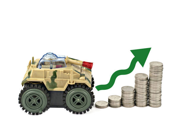 istock Tank,Up arrow and stack silver coins military budget. 1355930461