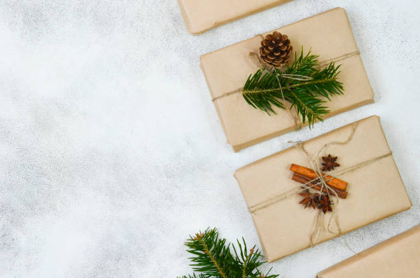 istock eco friendly merry christmas gift in craft paper wrapping, zero waste reusable concept, natural decor and sustainable lifestyle no people 1355931392