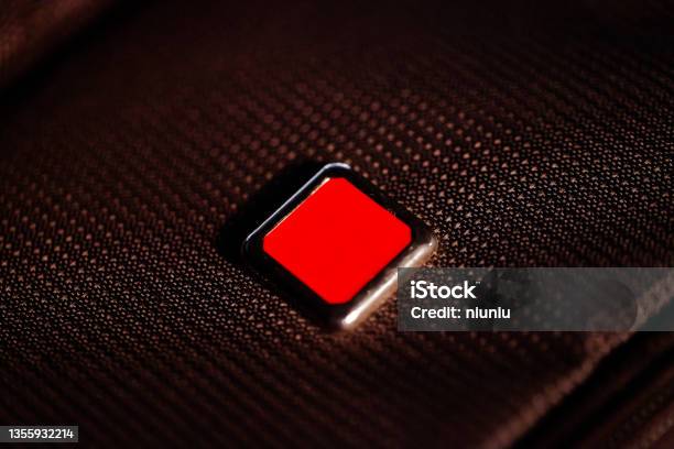 Red Shiny Button With Metal Elements Isolated On Black Background Stock Photo - Download Image Now