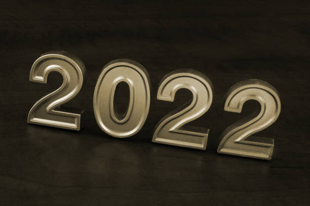 istock Numbers 2022 on wooden table close up 1355936636