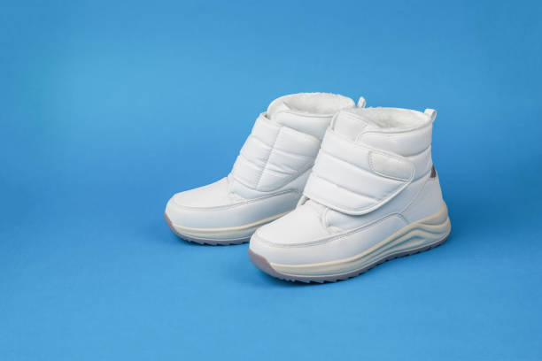 istock Sneakers for winter sports on a blue background. 1355938015