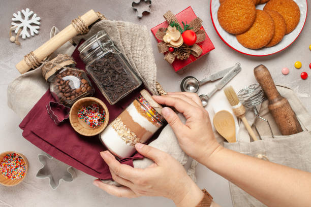 Ingredients for Christmas cookies in a jar on a festive background. Eco friendly or zero waste concept. Top view Ingredients for Christmas cookies in a jar on a festive background. Eco friendly or zero waste concept. Top view baking gift basket stock pictures, royalty-free photos  images