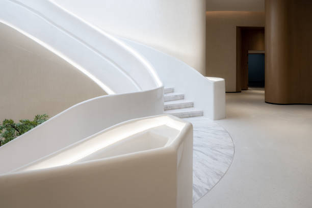 istock Spacious, clean and bright indoor spiral staircase 1355940421