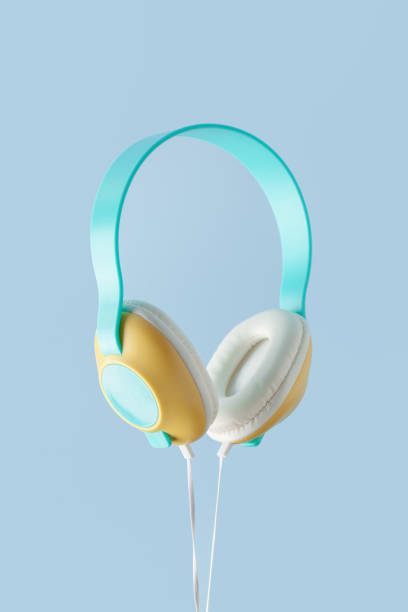 istock Colored wired headphones on a blue background 1355941091