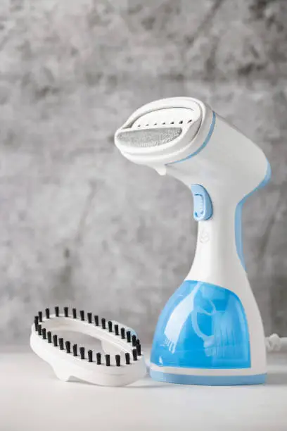 Portable home and travel garment steamer for clothes.  Housework