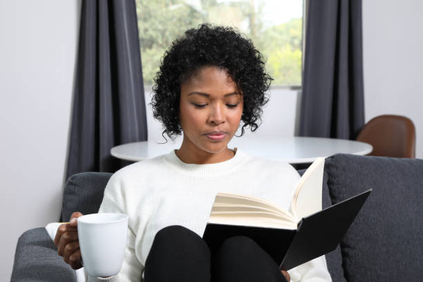 istock Analog Book Reader African American Woman MS Horizontal 1355942085