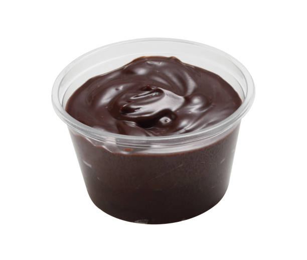 istock Chocolate cream in plastic cup isolated on white background 1355942973