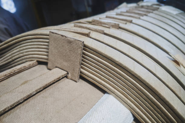 istock Closeup shot of transformer coil windings with paper insulation. 1355944941