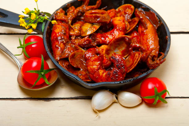 istock fresh seafoos stew on an iron skillet 1355947550