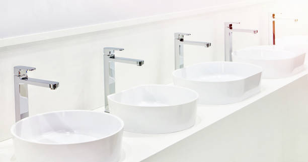 istock Ceramic sinks with faucets for bathrooms on exhibition 1355948492