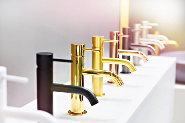 istock Plumbing and kitchen faucets in store 1355948557