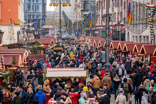 27 November 2019 - Worclaw, Poland: huge number of people during the Pandemic and the growth of diseases from Covid SARS-CoV-2 B.1.1.529 on Christmas Fair in Wroclaw, Poland