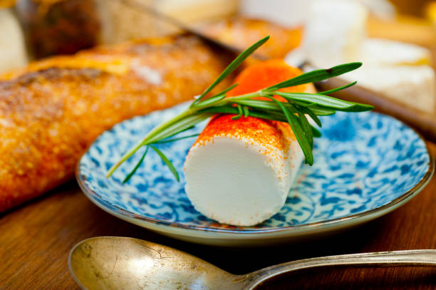 French cheese and fresh  baguette on a wood cutter