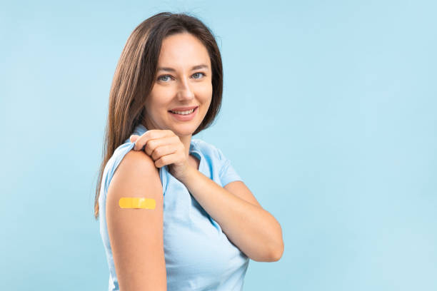 istock Smiling young woman after vaccination against coronavirus 1355951738