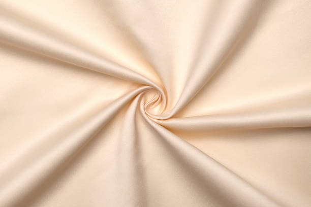 istock Background, texture. Template. Satin cloth for wedding and evening dresses. A nude shade. 1355951900