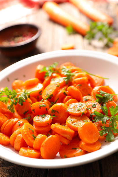 istock fried carrot with parsley in plate 1355953880