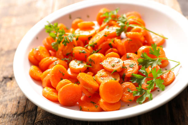istock fried carrot with parsley in plate 1355953882