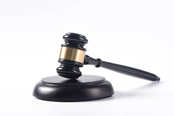 istock a wooden judge gavel isolated on white background 1355954288