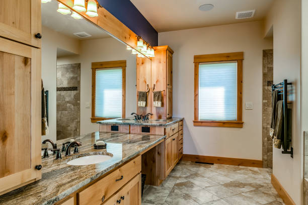 istock Master en suite with natural wood double vanity 1355956400