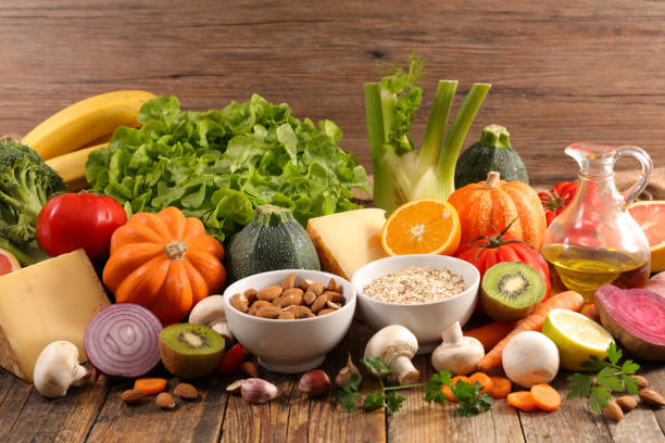istock health food selection ( fruit,  vegetable,  almond, cheese) 1355958823