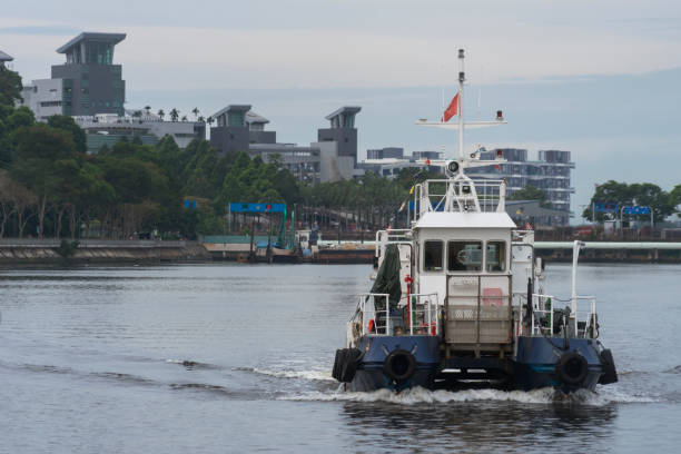 A vessel is seen travelling before Woodlands Checkpoint and the Causeway, off the coast of Singapore.