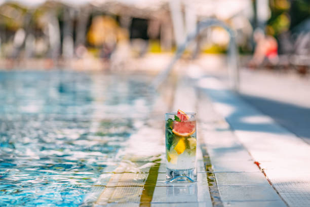 istock Delicious  Mojito Cocktail by the Pool 1355961012