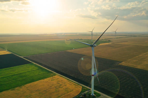 istock Aerial view on modern wind turbines. Alternative energy source 1355961744