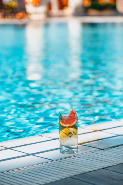 istock Delicious  Mojito Cocktail by the Pool 1355961791