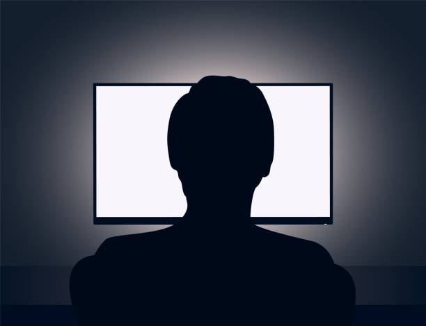 Man in front of a blank monitor Vector illustration of man sits in front of a blank monitor in dark room man in the desk back view stock illustrations