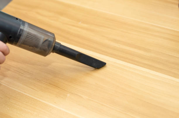 istock portable vacuum cleaner for housework use by hand on table 1355963006