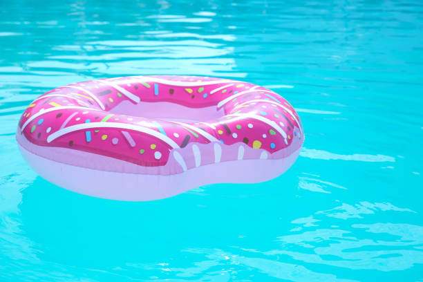 istock Inflatable ring in swimming pool on sunny day 1355964439