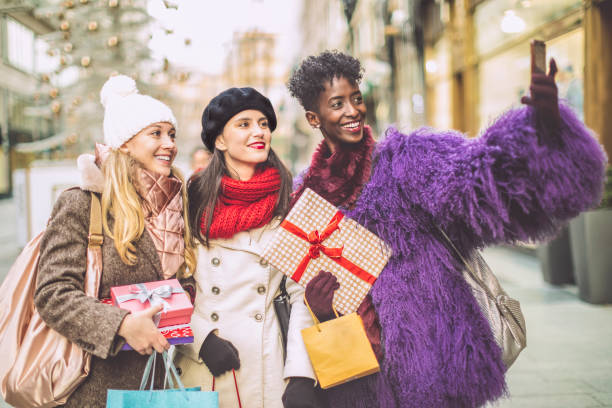 istock Friends are taking a selfies with Christmas presents 1355964474