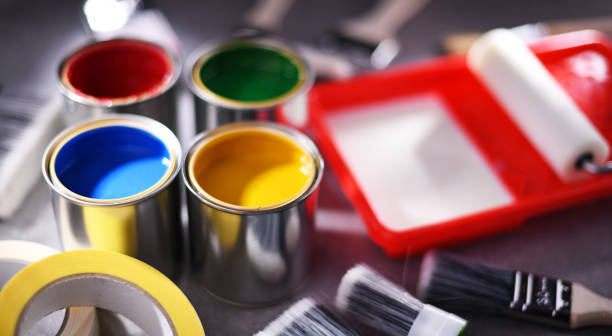 istock Paintbrushes of different size and paint cans 1355964649