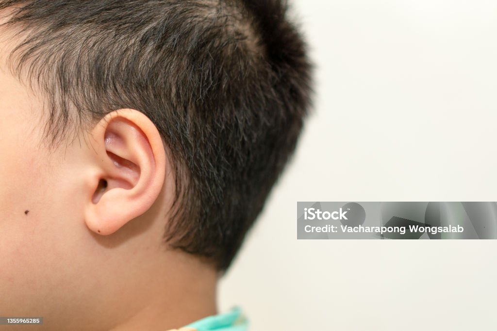 child ear side view see pinna and hold show hearing and medicine examination with copy space Care Stock Photo