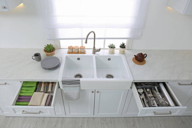 istock Open drawers with different utensils, towels and napkins in kitchen, above view 1355965426